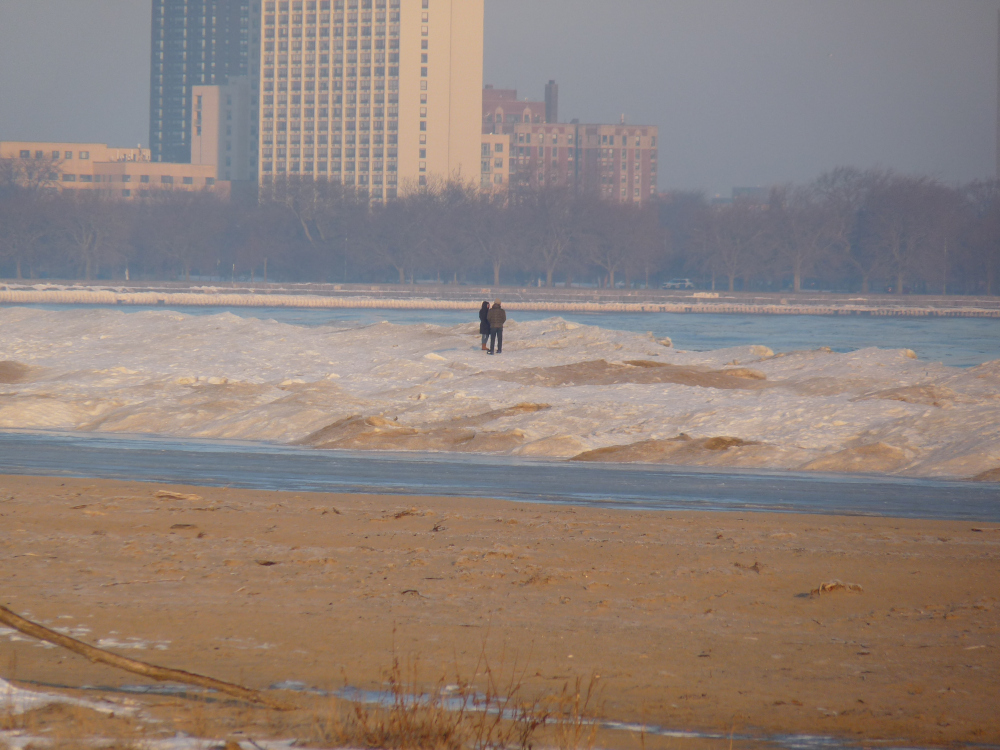 People standing on the shelf ice at Montrose Beach